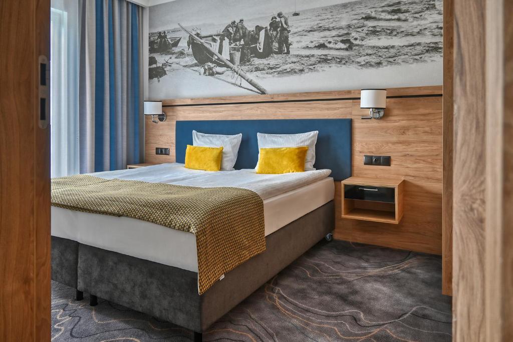 Postel nebo postele na pokoji v ubytování Sopotorium Hotel & Medical Spa