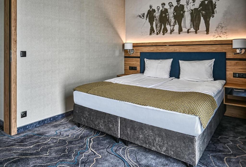 Postel nebo postele na pokoji v ubytování Sopotorium Hotel & Medical Spa