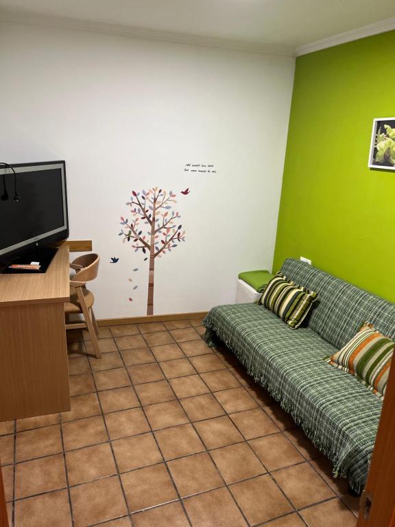 Televízia a/alebo spoločenská miestnosť v ubytovaní El Rento Alojamiento Rural