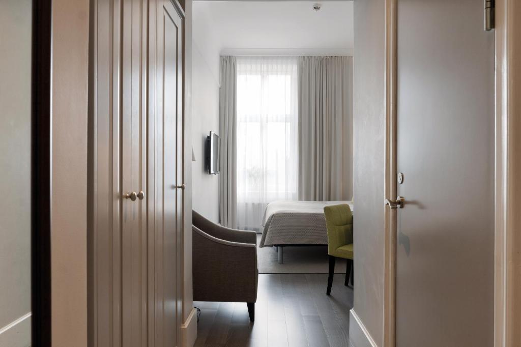 Postel nebo postele na pokoji v ubytování Elite Grand Hotel Gävle