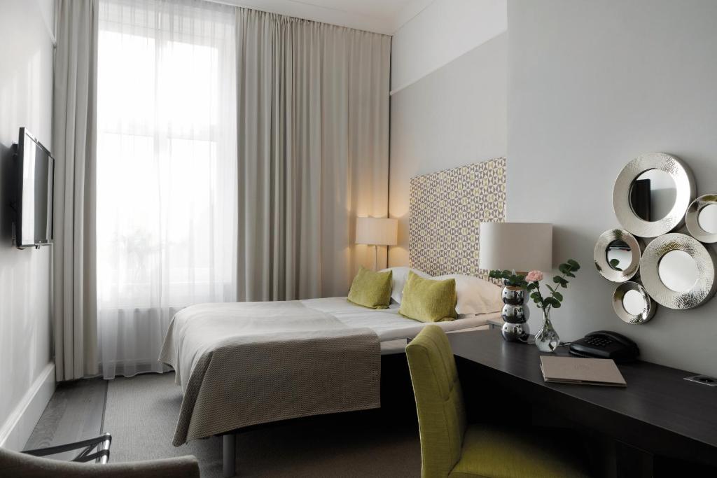 Postel nebo postele na pokoji v ubytování Elite Grand Hotel Gävle