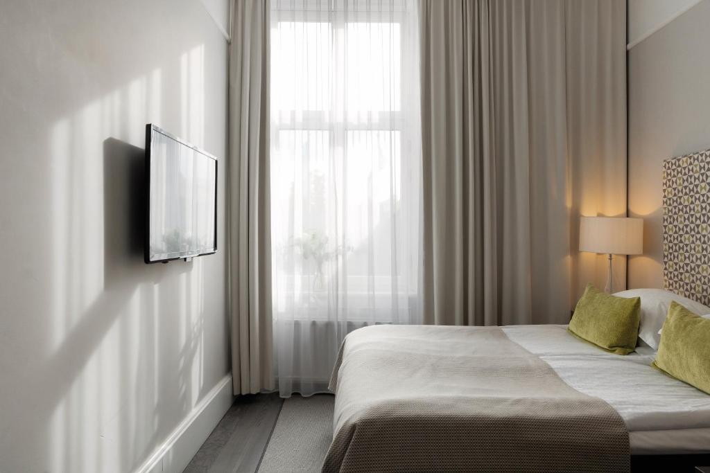 Postel nebo postele na pokoji v ubytování Elite Grand Hotel Gävle