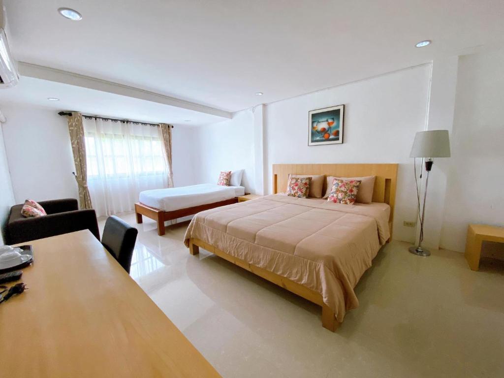 Łóżko lub łóżka w pokoju w obiekcie Sila Resort Sukhothai