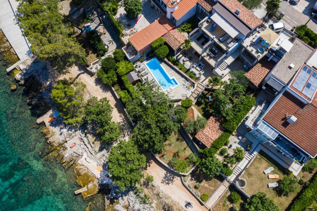 an aerial view of a house next to the water at Apartments Ana in Malinska