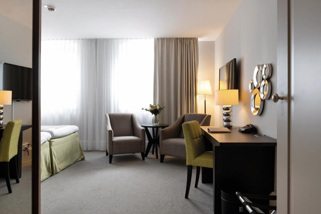 Postel nebo postele na pokoji v ubytování Elite Grand Hotel Gävle
