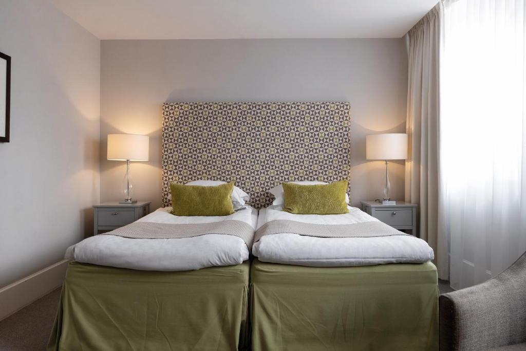 Postel nebo postele na pokoji v ubytování Elite Grand Hotel Gävle