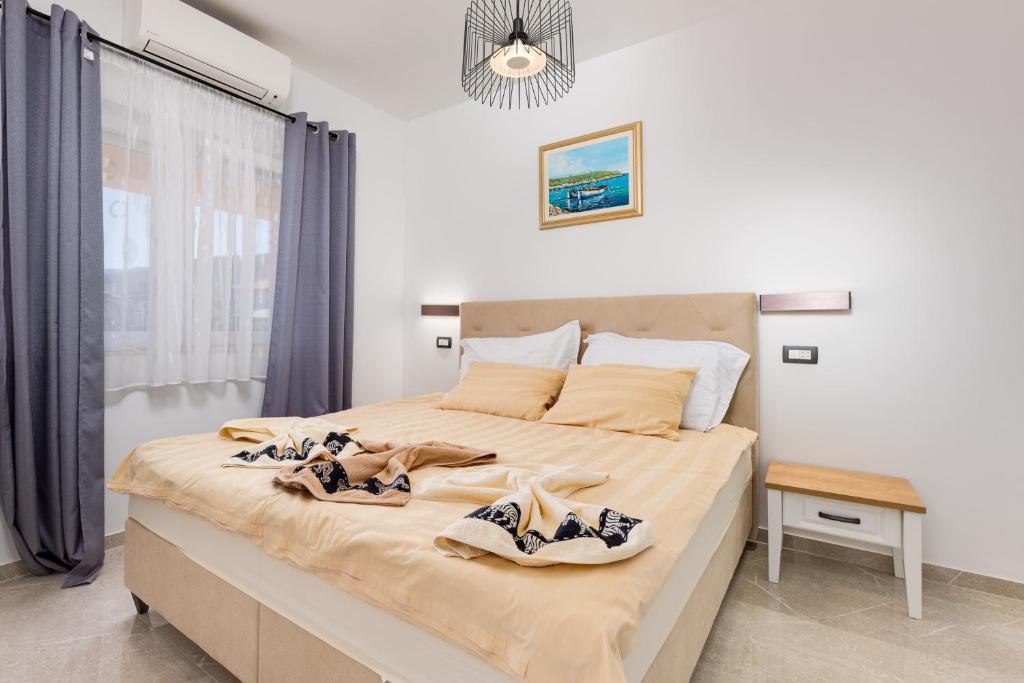 Posteľ alebo postele v izbe v ubytovaní Apartments "Two Mary"