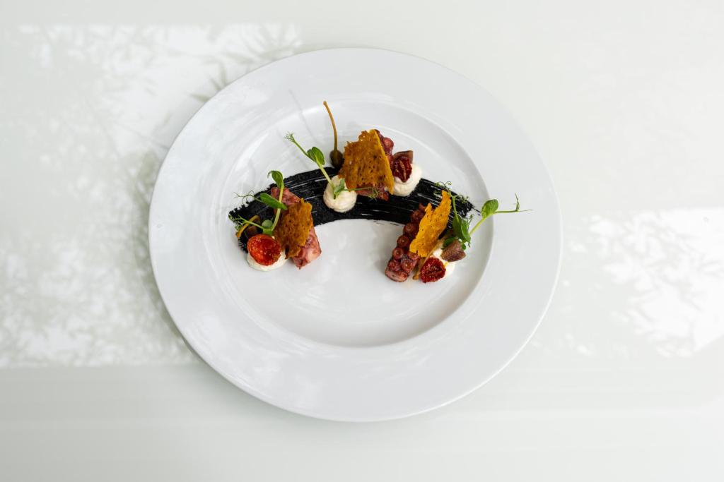 a plate of food on a white plate at Carrick Hotel Camogli Portofino Coast in Camogli