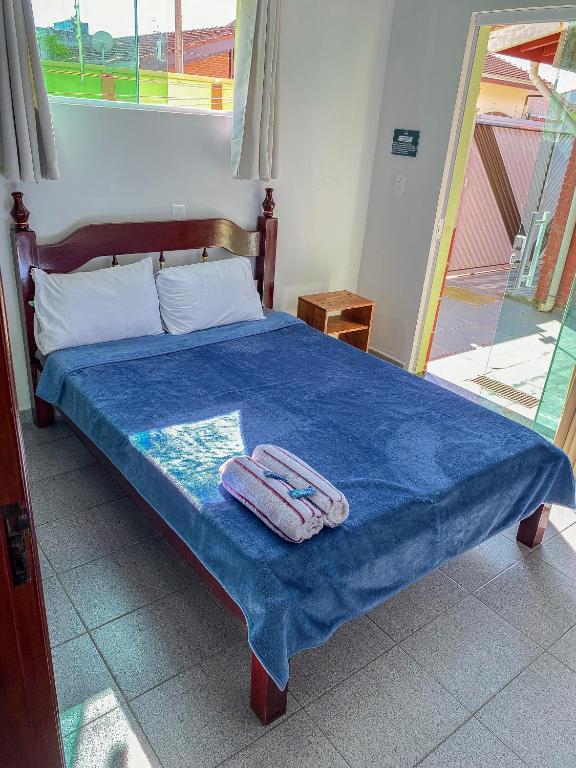 Postel nebo postele na pokoji v ubytování Vila Itanhaém