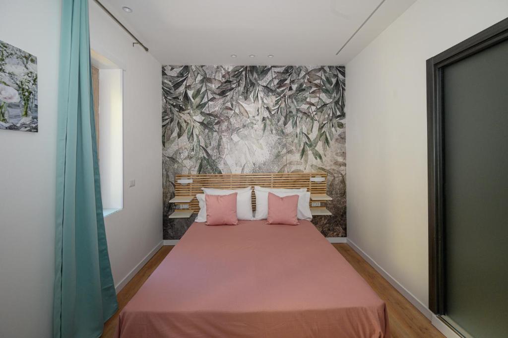 Posteľ alebo postele v izbe v ubytovaní B&B Magia