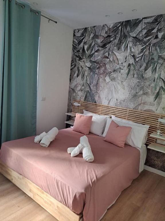 Posteľ alebo postele v izbe v ubytovaní B&B Magia