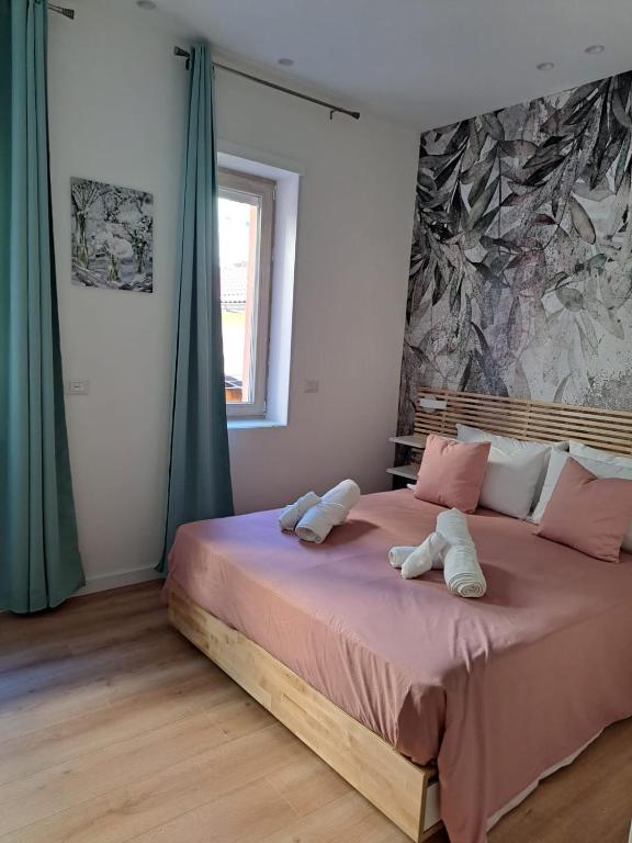 Posteľ alebo postele v izbe v ubytovaní B&B Magia