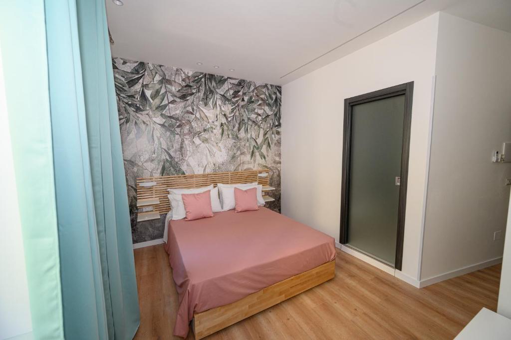 Posteľ alebo postele v izbe v ubytovaní B&B Magia