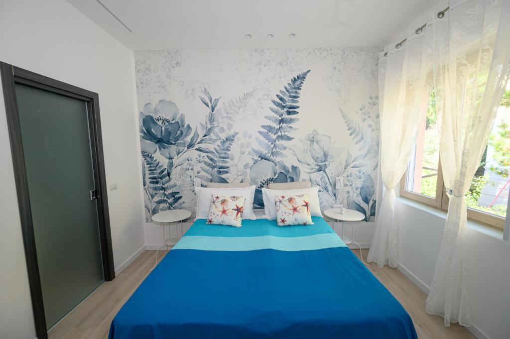 Posteľ alebo postele v izbe v ubytovaní B&B Magia