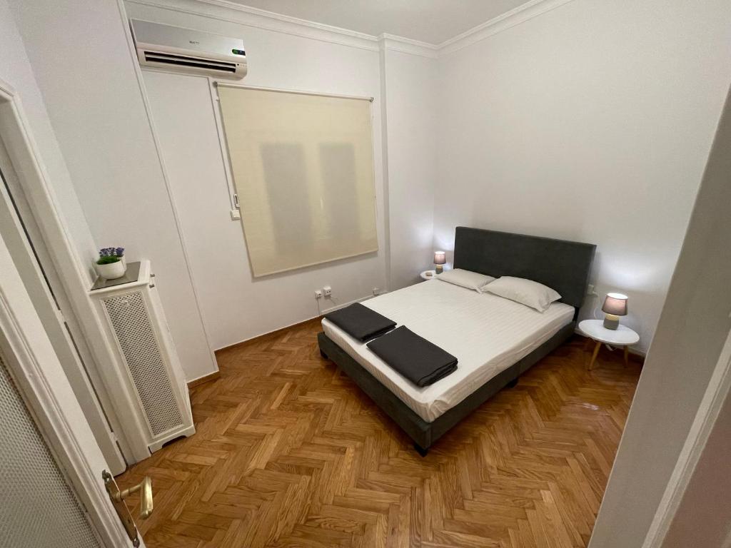 Postel nebo postele na pokoji v ubytování Parliament Place