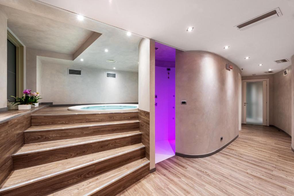 a wellness room with a hot tub in a building at Carrick Hotel Camogli Portofino Coast in Camogli