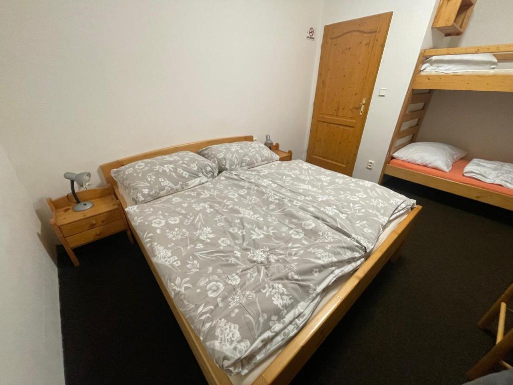 Postel nebo postele na pokoji v ubytování Penzion Štvanice