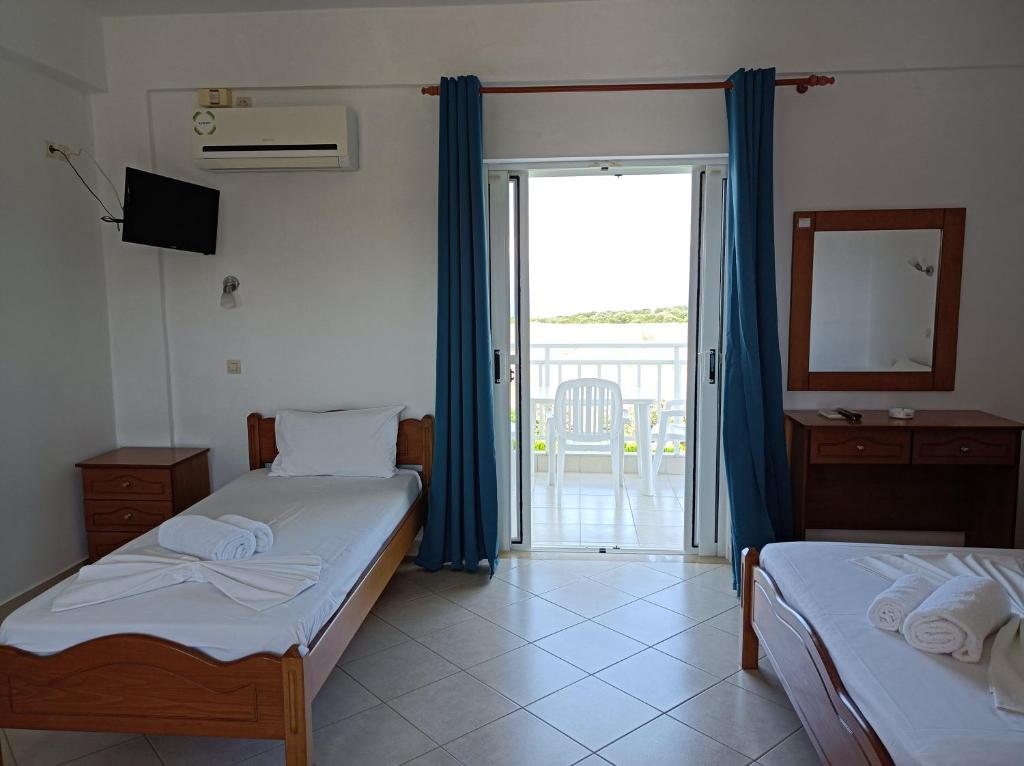 Postel nebo postele na pokoji v ubytování Kipriotis Hotel