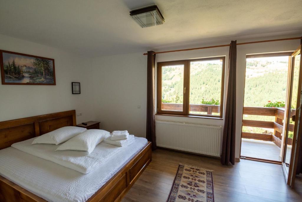 Postel nebo postele na pokoji v ubytování Cabana Denisa