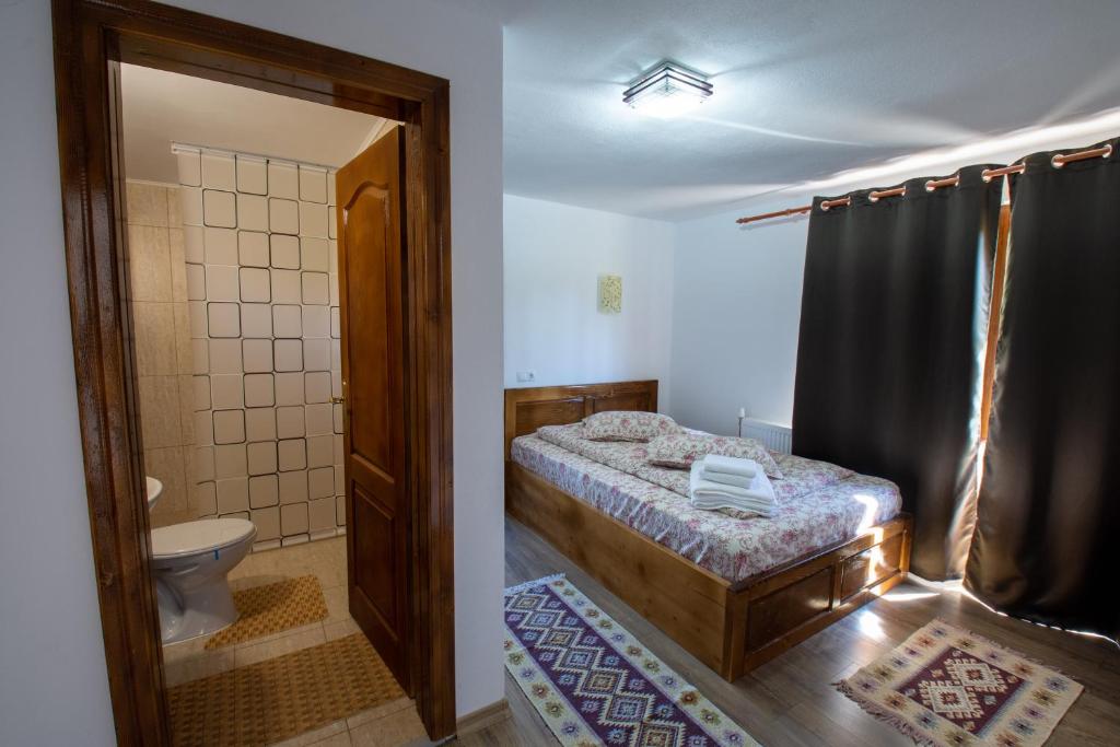Postel nebo postele na pokoji v ubytování Cabana Denisa