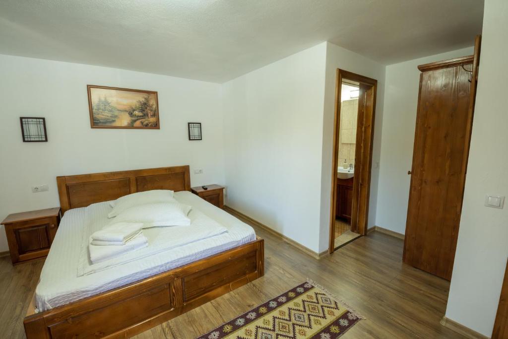 Postel nebo postele na pokoji v ubytování Cabana Denisa