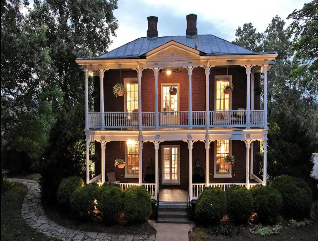 a large victorian house with a porch at Red Hill Bed and Breakfast in Lovingston