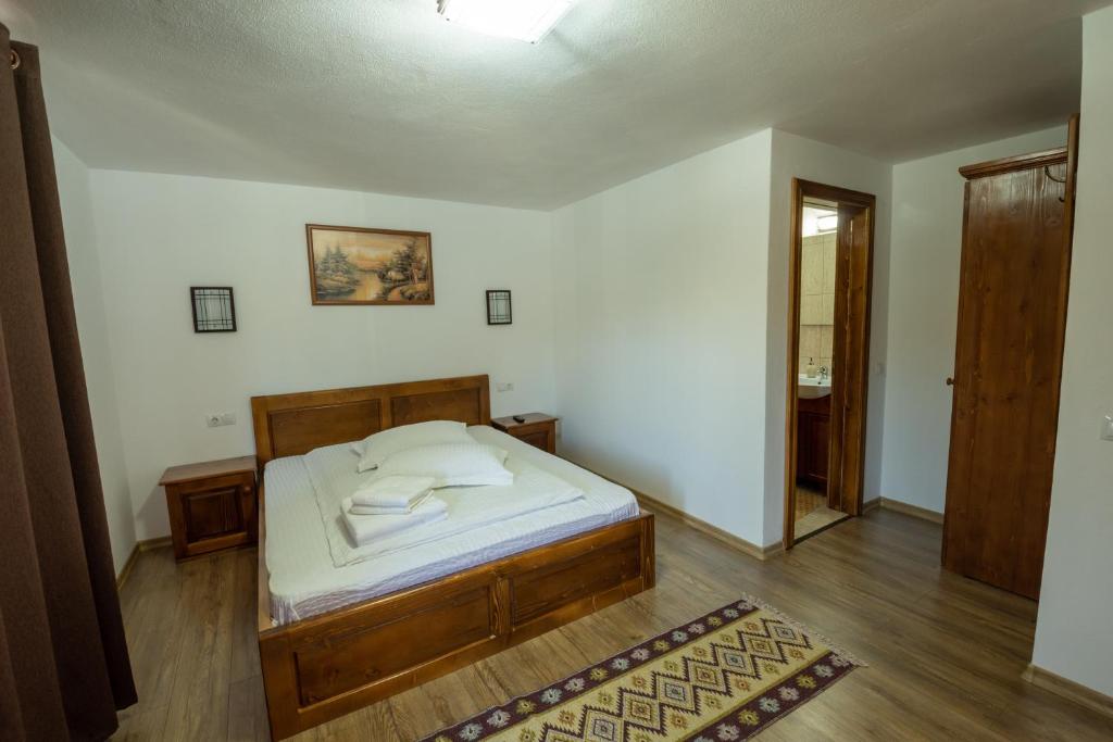 Postel nebo postele na pokoji v ubytování Cabana Denisa