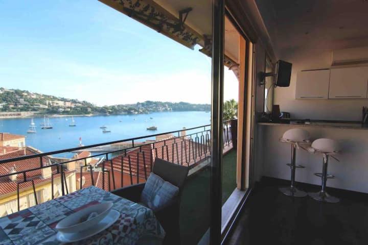 a room with a balcony with a view of the water at Excellent location - Sea Views in Villefranche-sur-Mer