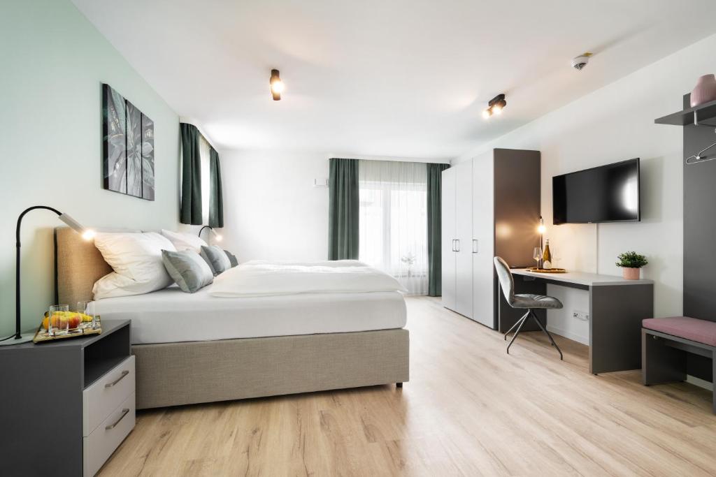 Postel nebo postele na pokoji v ubytování Snooze Apartments Alling