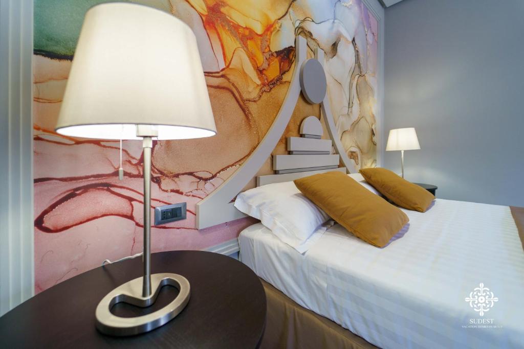 Postel nebo postele na pokoji v ubytování Matteotti Luxury Residence