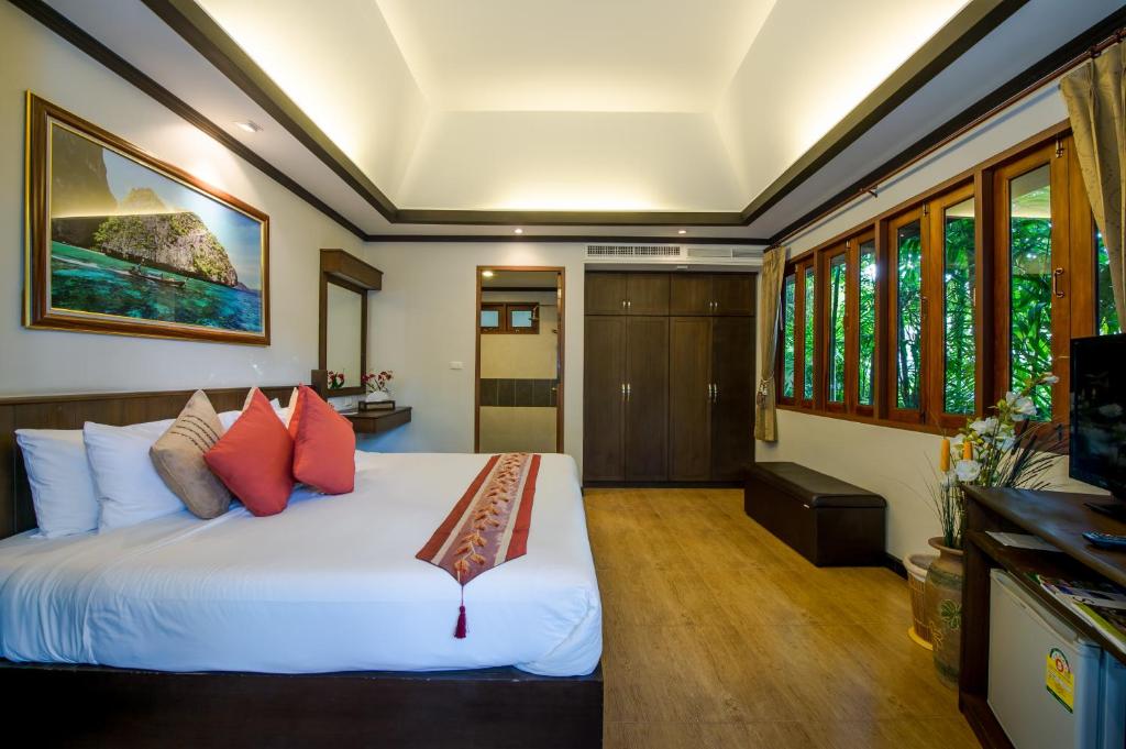Ein Bett oder Betten in einem Zimmer der Unterkunft Pai Tan Villas - SHA Extra Plus