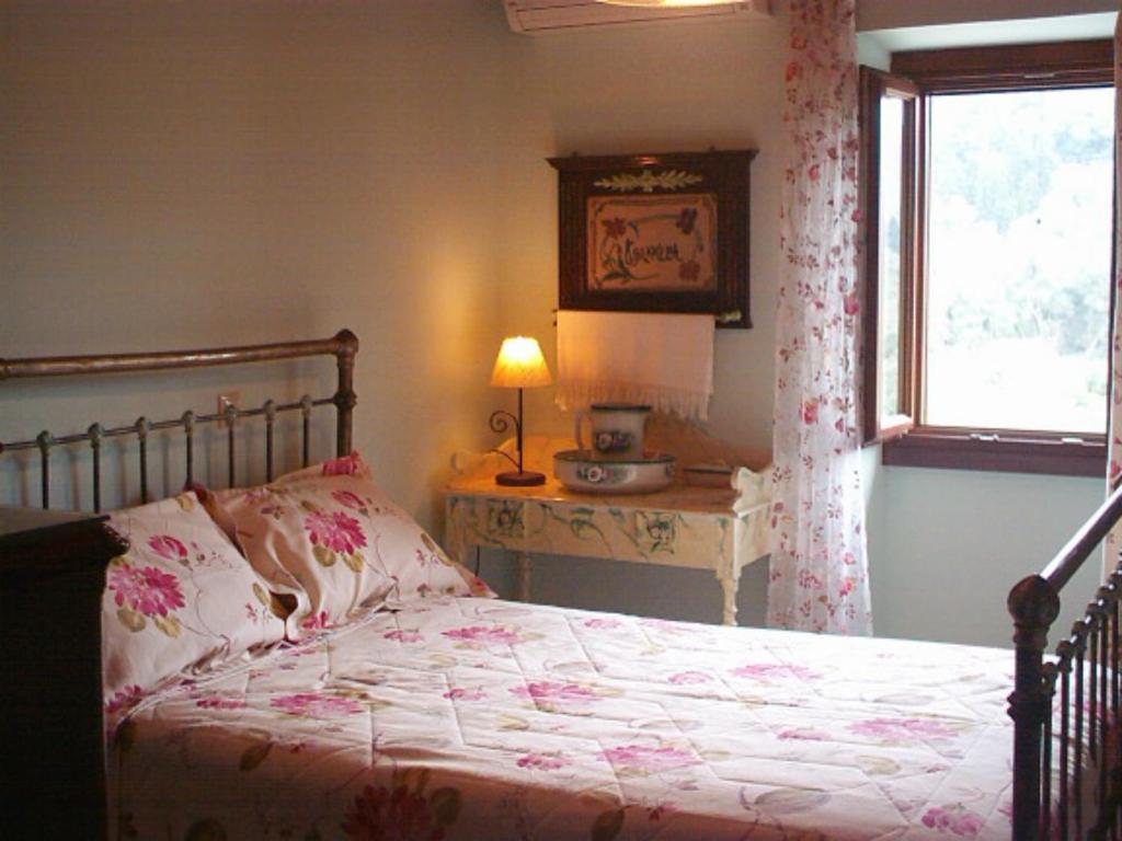 Postel nebo postele na pokoji v ubytování Villa Ermis