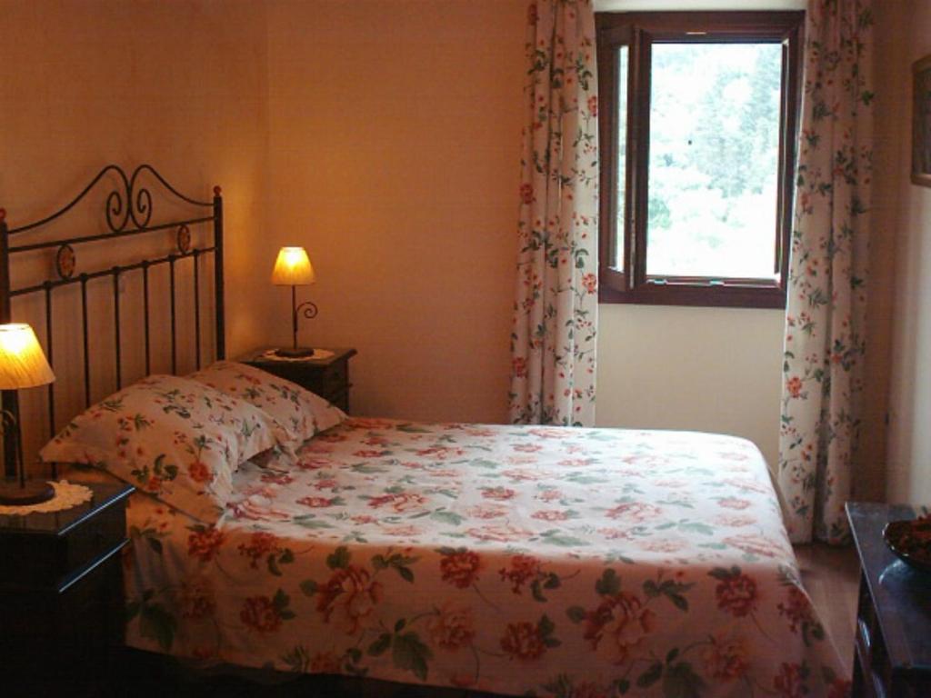 Postel nebo postele na pokoji v ubytování Villa Ermis