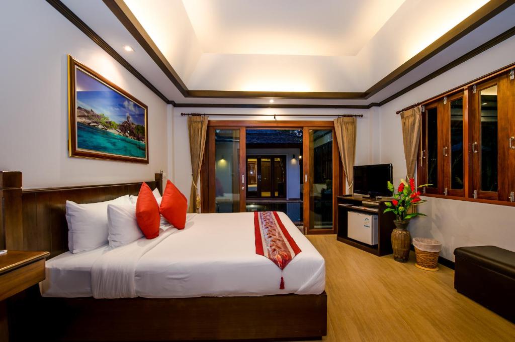 Ein Bett oder Betten in einem Zimmer der Unterkunft Pai Tan Villas - SHA Extra Plus