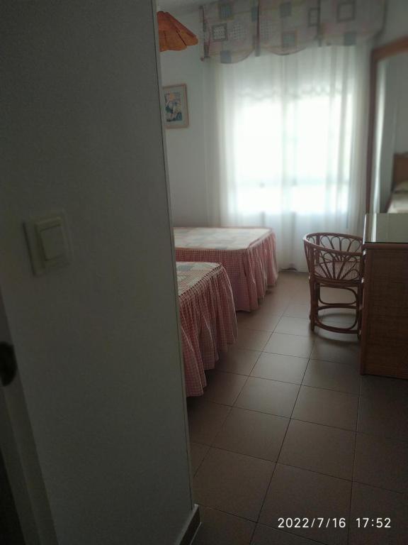 Łóżko lub łóżka w pokoju w obiekcie HUELVA PLAYAS DEL SUR