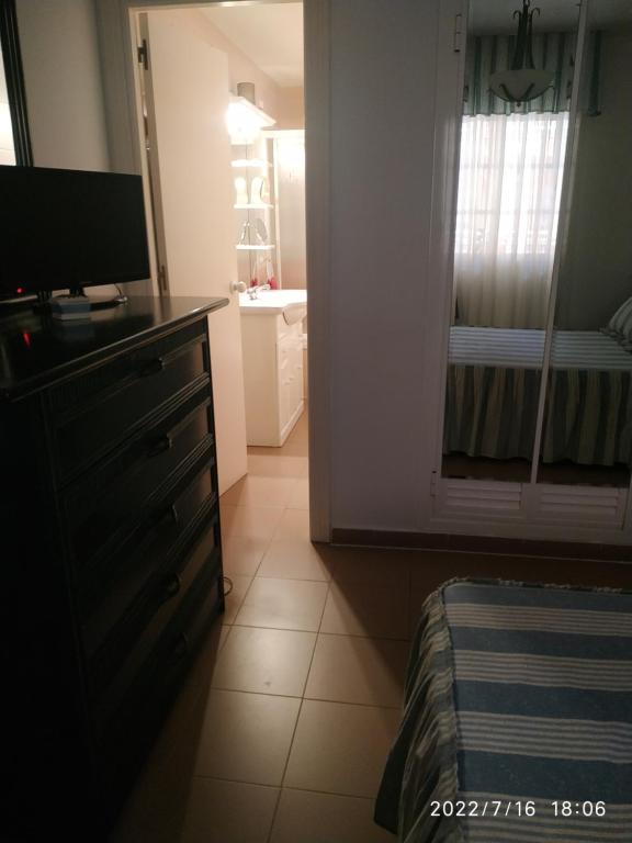 Łóżko lub łóżka w pokoju w obiekcie HUELVA PLAYAS DEL SUR