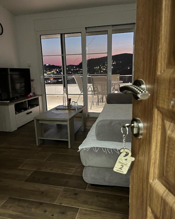 a living room with a door with a key at Demiri Rr in Ulcinj