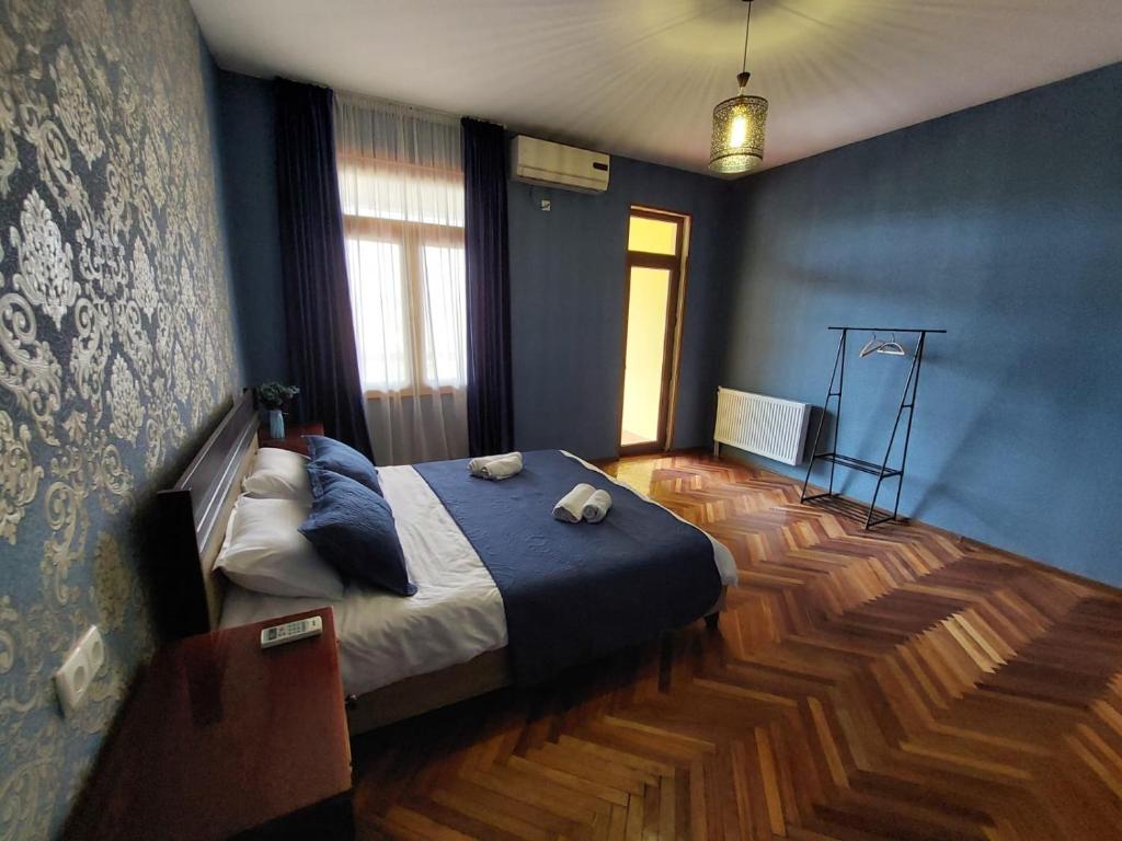 Postel nebo postele na pokoji v ubytování Guesthouse ''Door'' in Sighnaghi