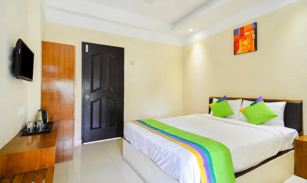En eller flere senge i et værelse på Itsy By Treebo - Platinum Inn