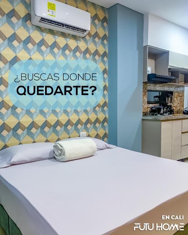 a bed in a kitchen with a sign that reads jossgas donate outpatient at Edificio La Alameda in Cali