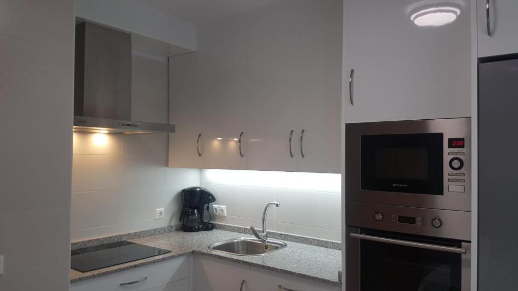 Kuchyň nebo kuchyňský kout v ubytování APARTAMENTO A CHILENA