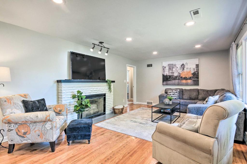 a living room with a couch and a fireplace at Charming Springfield Home with Private Backyard in Springfield