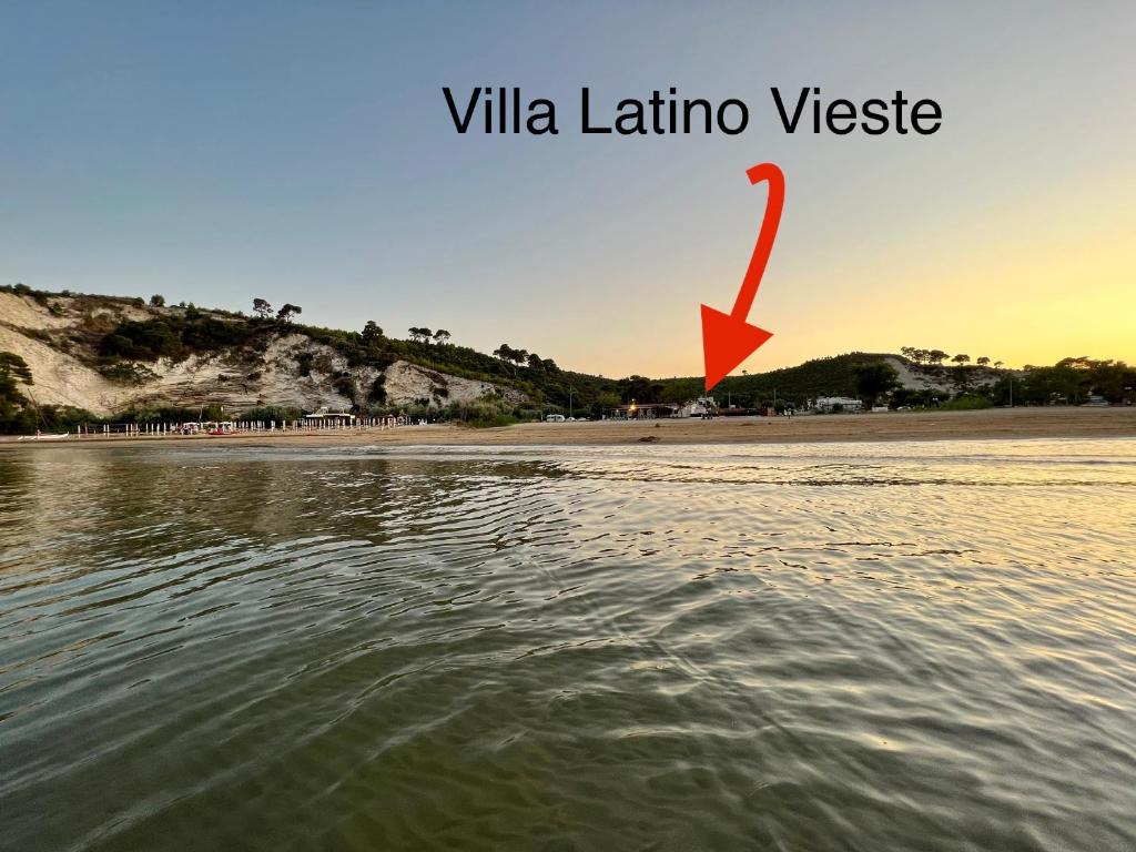a view of a beach with a red arrow at Villa Latino in Vieste