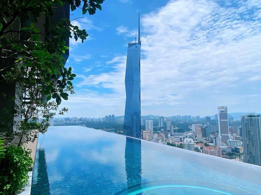 a infinity pool with a view of a city at Infinity pool/ Lucentia BBCC, near LALAPORT, PNB118, KLCC in Kuala Lumpur