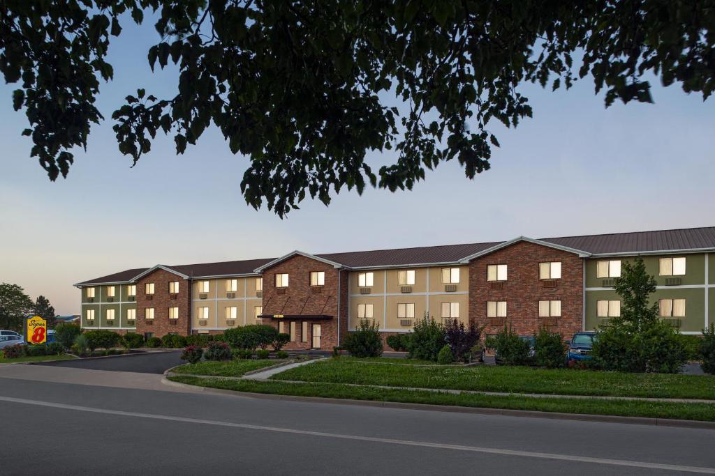 a rendering of an apartment complex on a street at Super 8 by Wyndham Lenexa Overland Park Area/Mall Area in Lenexa