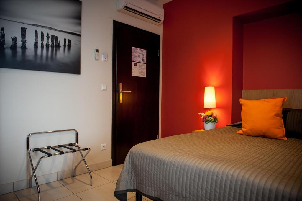 Postel nebo postele na pokoji v ubytování Hotel Pax
