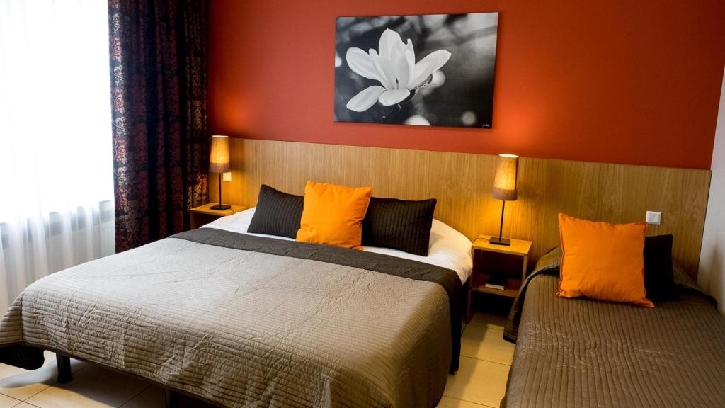 Postel nebo postele na pokoji v ubytování Hotel Pax