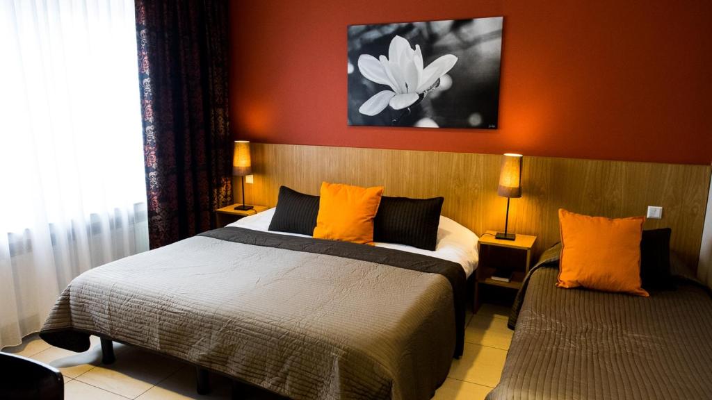 Postel nebo postele na pokoji v ubytování Hotel Pax