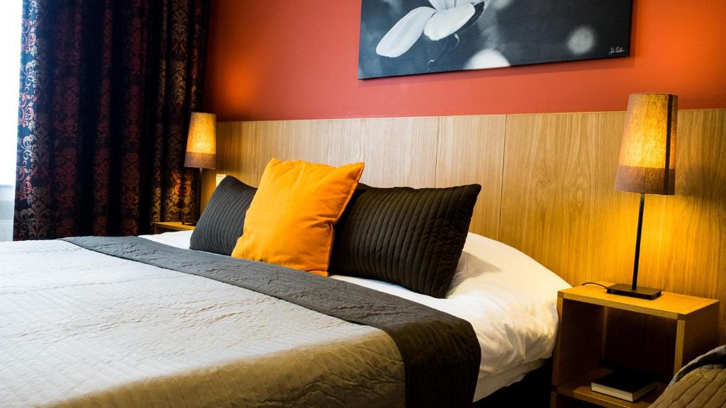 Postel nebo postele na pokoji v ubytování Hotel Pax