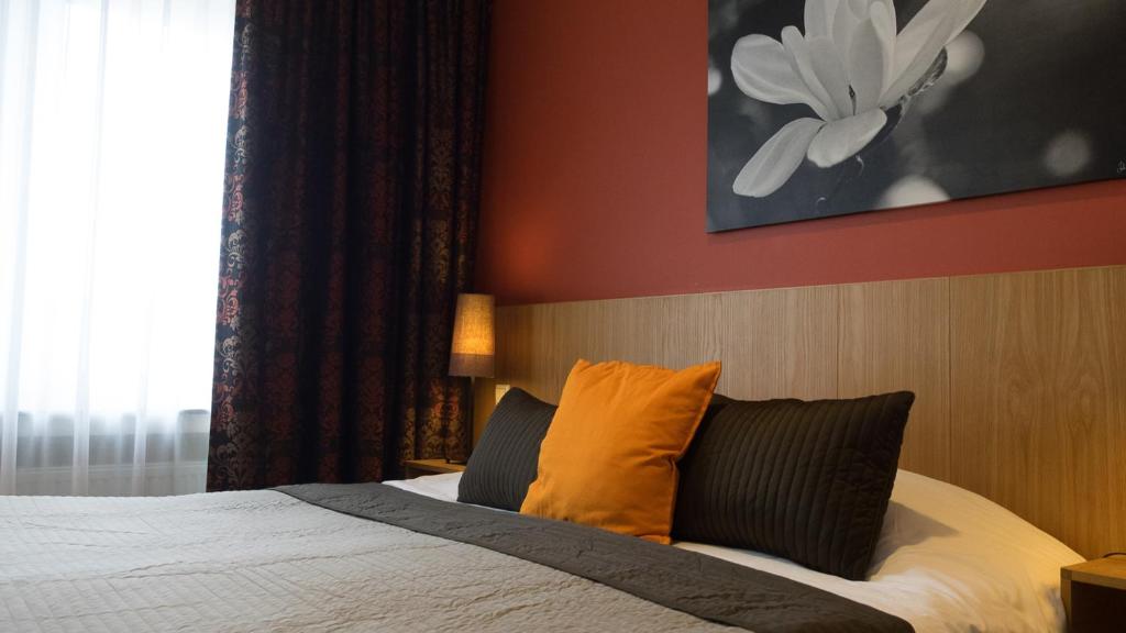 Postel nebo postele na pokoji v ubytování Hotel Pax